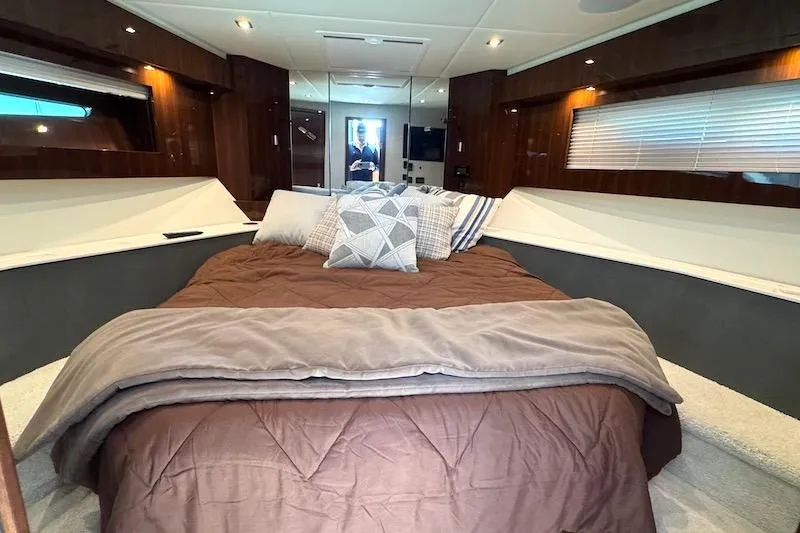Slide: The Image of Luxurious bedroom interior of 2023 Cruisers Yachts 50 Cantius with plush bedding. - 38