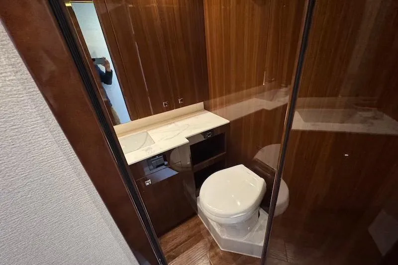 Slide: The Image of Luxurious bathroom in 2023 Cruisers Yachts 50 Cantius with wood paneling and modern fixtures. - 47