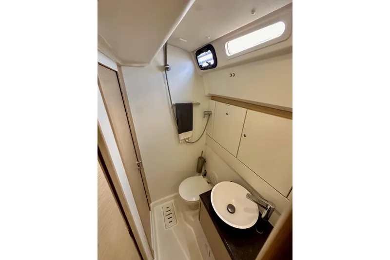 Slide: The Image of 2018 Jeanneau 54 yacht bathroom with modern fixtures and compact design. - 71