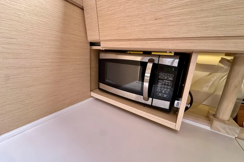 Slide: The Image of Built-in microwave in Jeanneau 54 yacht's modern kitchen, 2018 model. - 92