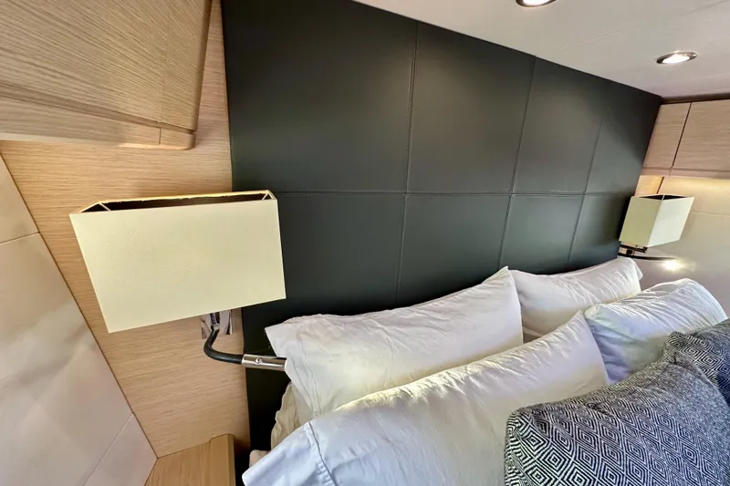 Slide: The Image of Luxurious interior of 2018 Jeanneau 54 yacht with elegant bedding and modern lighting. - 100