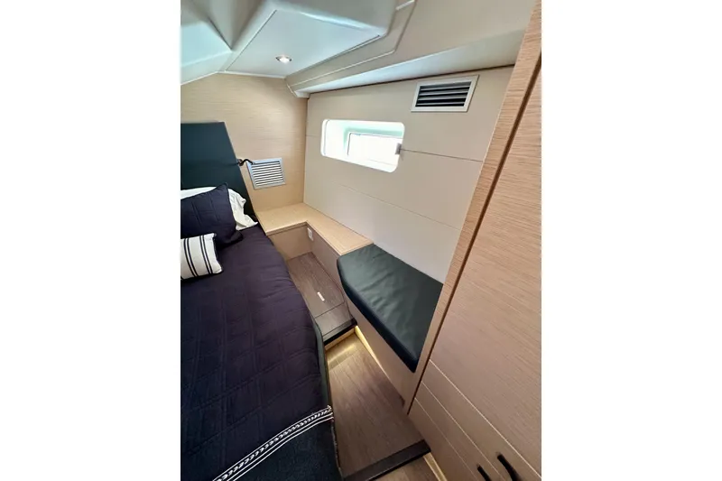 Slide: The Image of Luxurious interior cabin of 2018 Jeanneau 54 yacht with modern design and cozy bedding. - 79