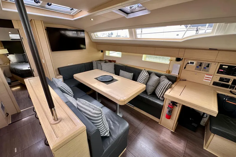 Slide: The Image of Luxurious interior of 2018 Jeanneau 54 yacht with modern seating and dining area. - 86