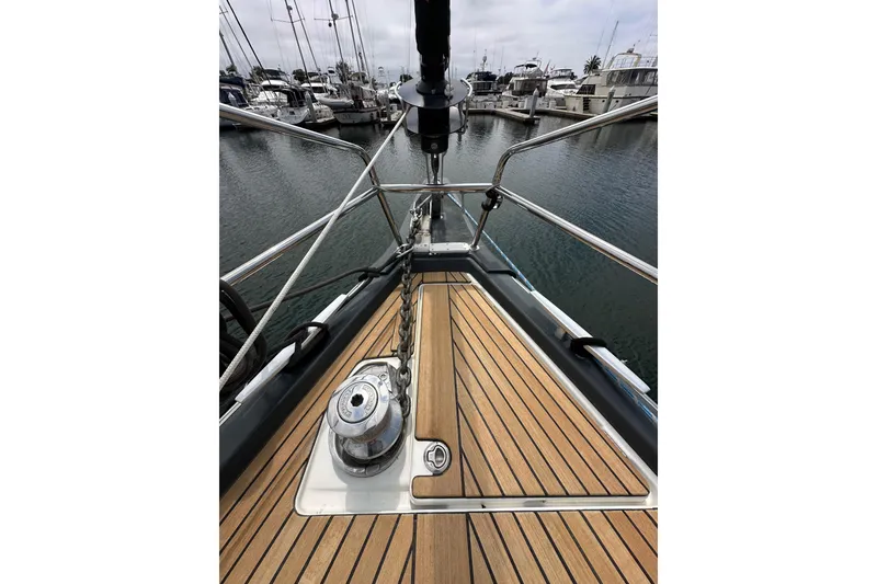 Slide: The Image of Bow view of 2018 Jeanneau 54 yacht with teak deck and anchor chain. - 46