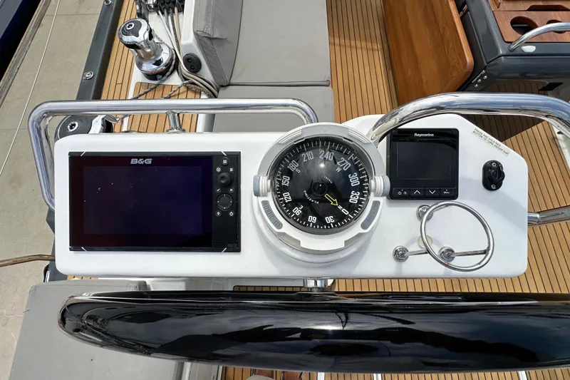 Slide: The Image of Cockpit of 2018 Jeanneau 54 yacht with navigation instruments and compass. - 31