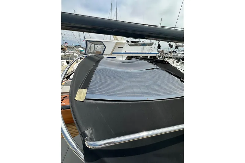 Slide: The Image of 2018 Jeanneau 54 yacht with solar panel on deck, docked at marina. - 39