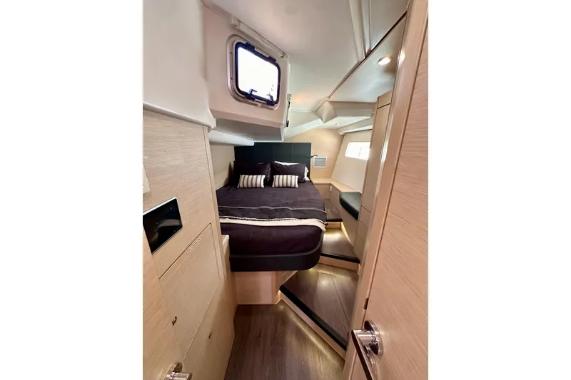Slide: The Image of Luxurious cabin interior of 2018 Jeanneau 54 yacht with modern design and cozy bedding. - 77