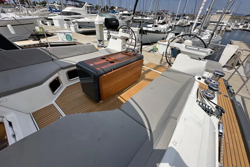 Slide: The Image of Luxury Jeanneau 54 yacht cockpit with teak flooring, 2018 model, docked at marina. - 57
