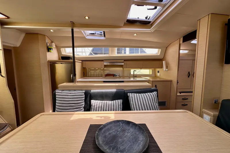 Slide: The Image of Luxurious interior of 2018 Jeanneau 54 yacht with modern kitchen and dining area. - 88