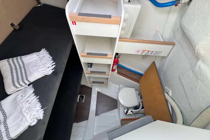 Slide: The Image of Interior of 2018 Jeanneau 54 yacht featuring compact bathroom and storage shelves. - 44
