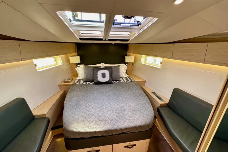 Slide: The Image of Luxurious cabin interior of 2018 Jeanneau 54 yacht with skylight and modern furnishings. - 99