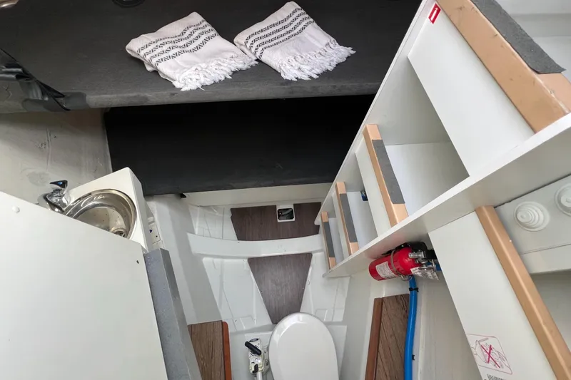 Slide: The Image of Interior of 2018 Jeanneau 54 yacht featuring compact bathroom and storage area. - 45