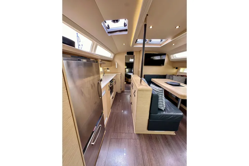 Slide: The Image of Luxurious interior of 2018 Jeanneau 54 yacht with modern kitchen and dining area. - 85