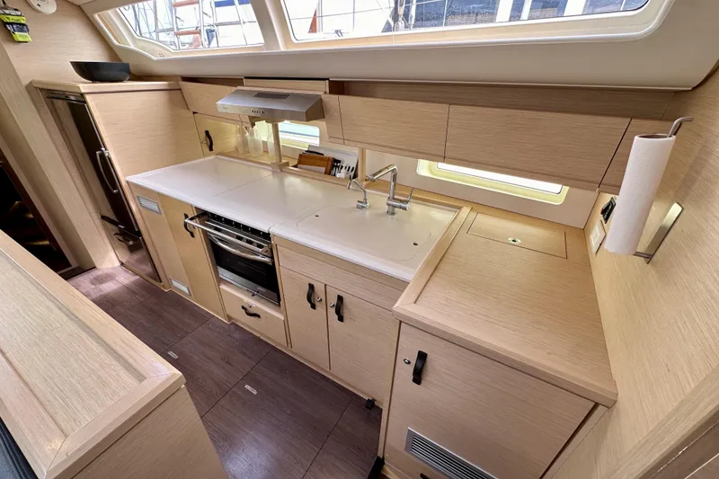 Slide: The Image of Modern kitchen interior of 2018 Jeanneau 54 yacht with sleek cabinetry and appliances. - 95