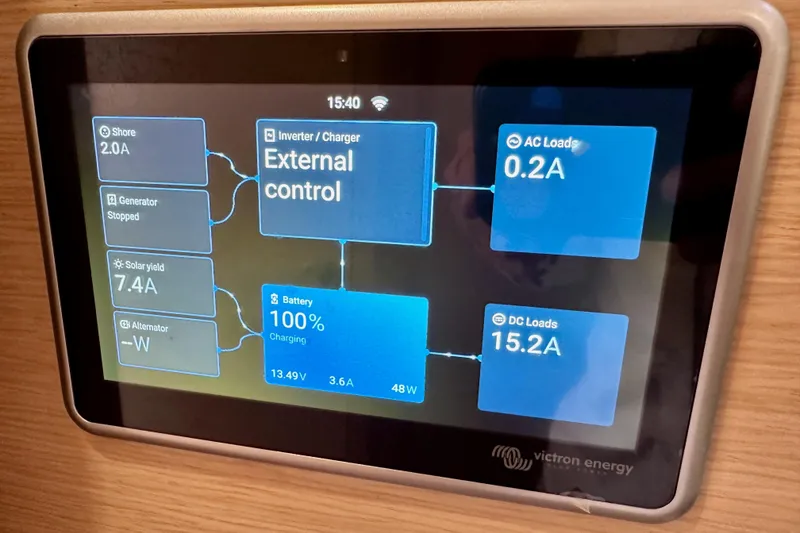 Slide: The Image of Control panel display on a 2018 Jeanneau 54 yacht showing battery and power status. - 84