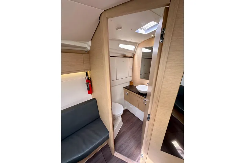 Slide: The Image of Interior of 2018 Jeanneau 54 yacht showing bathroom and seating area. - 102