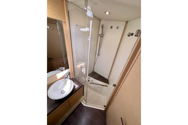 Slide: The Image of Modern bathroom in 2018 Jeanneau 54 yacht with shower and sink. - 104