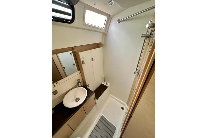Slide: The Image of Modern bathroom interior of 2018 Jeanneau 54 yacht, featuring sleek sink and shower. - 82