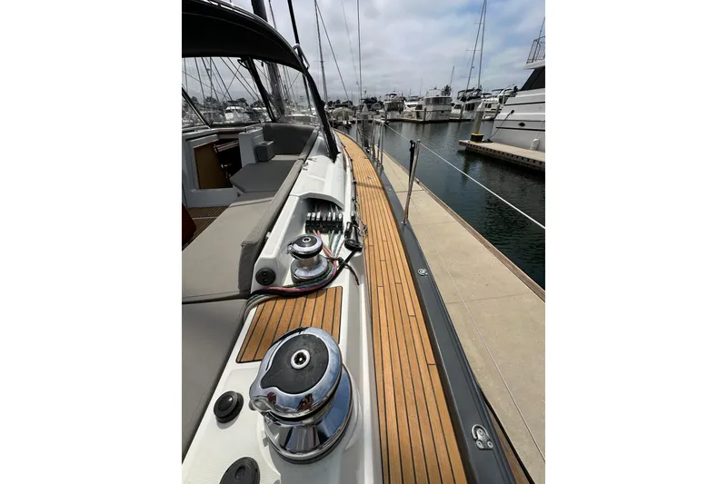 Slide: The Image of Jeanneau 54 sailboat deck, 2018 model, docked at marina with polished winches. - 36