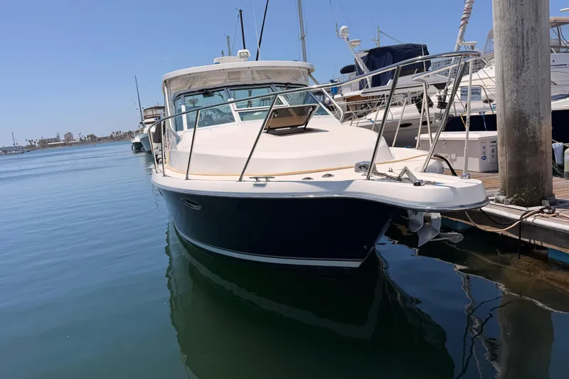 Slide: The Image of 2005 Tiara Yachts 2900 Open Classic docked in a marina. - 1