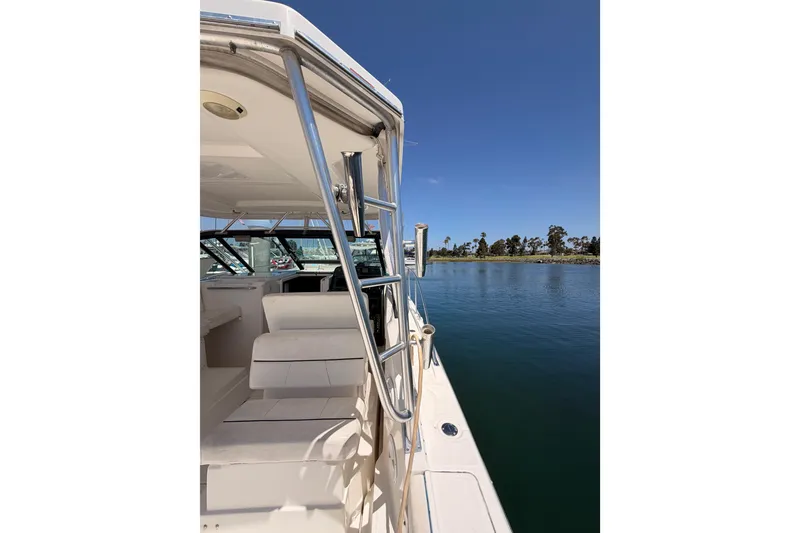 Slide: The Image of 2005 Tiara Yachts 2900 Open Classic on calm water, clear sky background. - 17