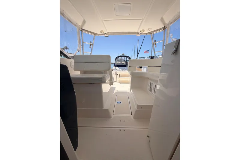 Slide: The Image of Interior view of a 2005 Tiara Yachts 2900 Open Classic, showcasing seating and helm area. - 72