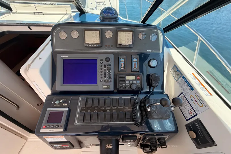 Slide: The Image of Control panel of a 2005 Tiara Yachts 2900 Open Classic, featuring navigation and communication equipment. - 33