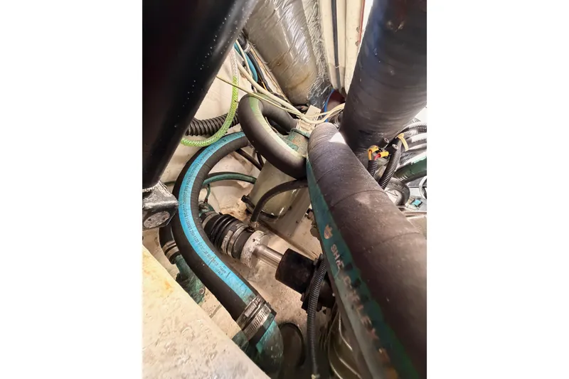 Slide: The Image of Engine compartment of a 2005 Tiara Yachts 2900 Open Classic, showcasing hoses and components. - 85