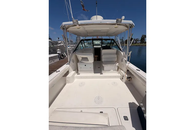Slide: The Image of 2005 Tiara Yachts 2900 Open Classic boat interior with seating and storage. - 9
