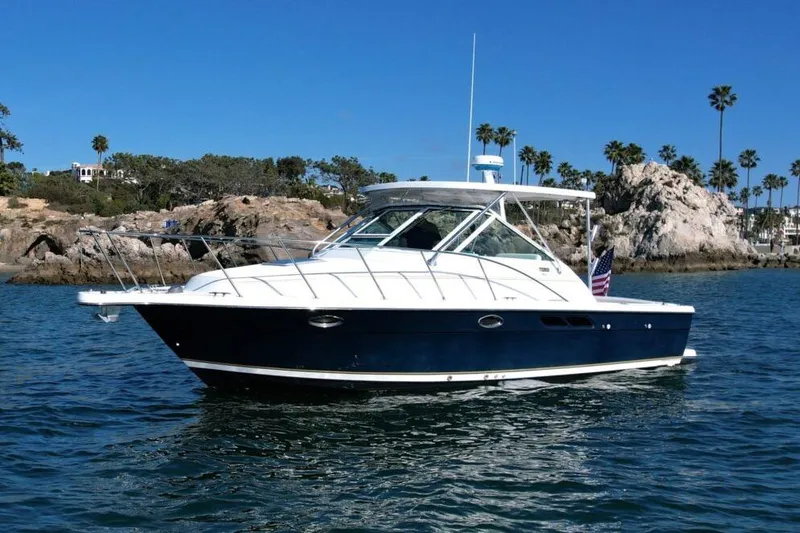 The Image of 2005 Tiara Yachts 2900 Open Classic boat on scenic coastal waters. - 0
