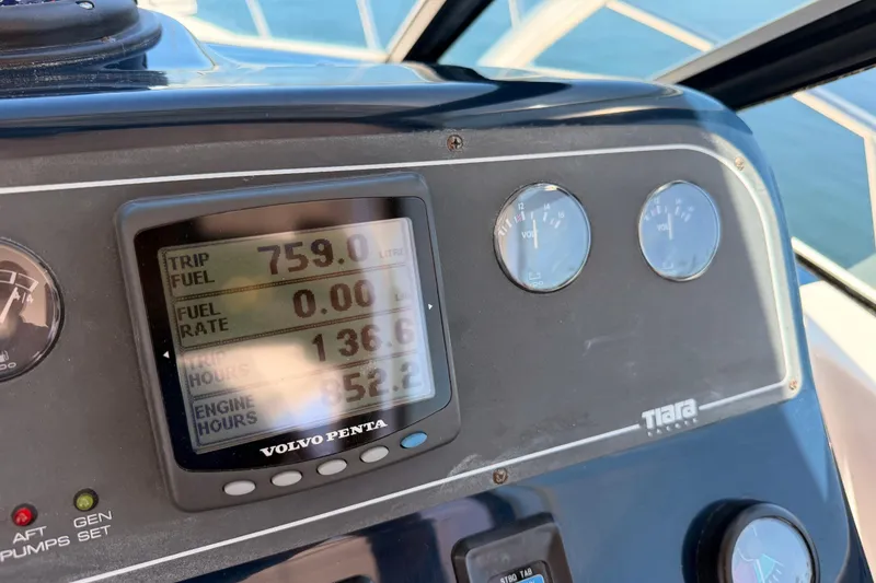 Slide: The Image of Dashboard of a 2005 Tiara Yachts 2900 Open Classic, displaying trip and engine data. - 38