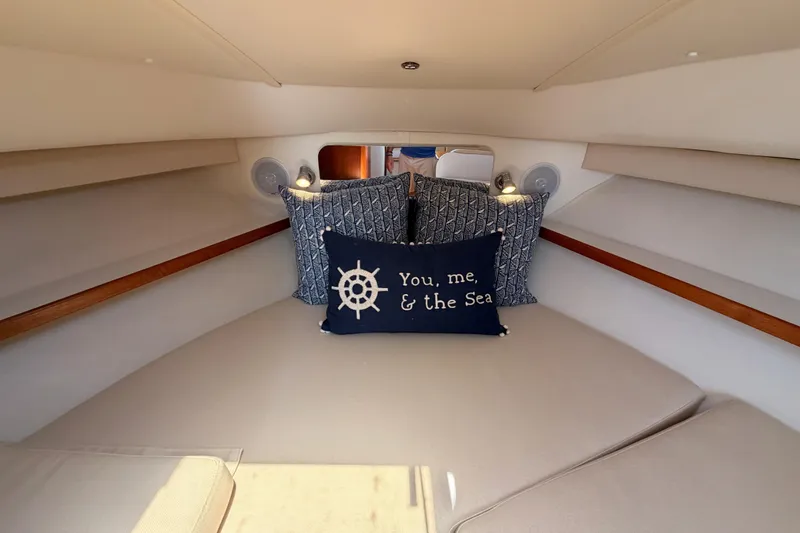 Slide: The Image of Cozy cabin interior of 2005 Tiara Yachts 2900 Open Classic with nautical-themed pillows. - 68