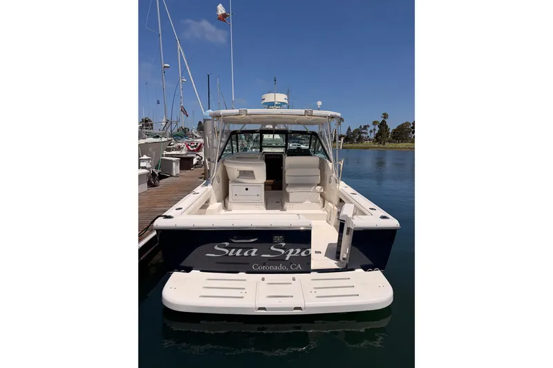 Slide: The Image of 2005 Tiara Yachts 2900 Open Classic docked in a marina, rear view. - 8