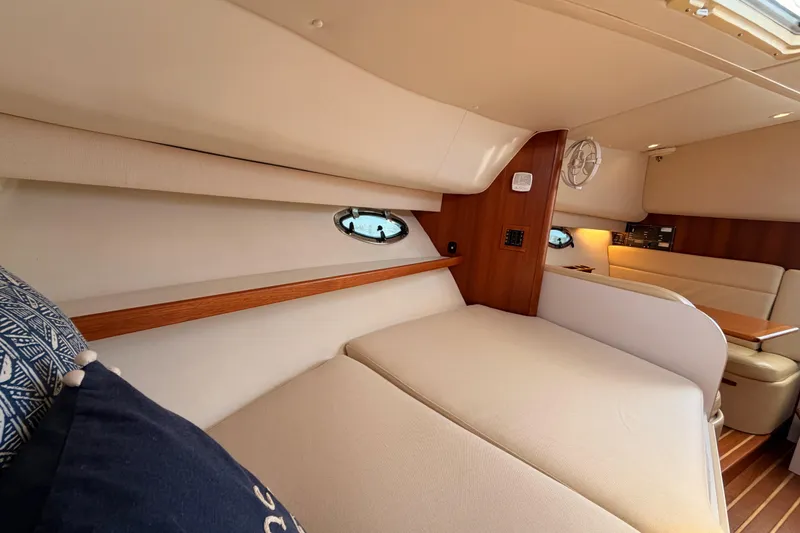 Slide: The Image of Interior of 2005 Tiara Yachts 2900 Open Classic, featuring cozy seating and elegant wood accents. - 70