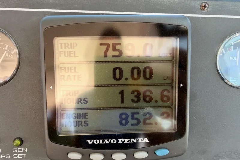Slide: The Image of Volvo Penta display showing trip fuel, hours, and engine data on a 2005 Tiara Yachts 2900 Open Classic. - 39