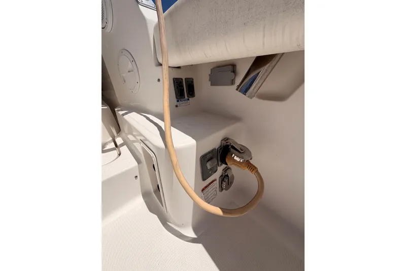 Slide: The Image of 2005 Tiara Yachts 2900 Open Classic power connection and control panel. - 14