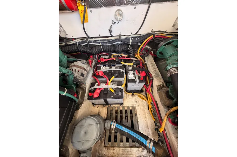 Slide: The Image of Engine compartment of 2005 Tiara Yachts 2900 Open Classic with batteries and wiring. - 82