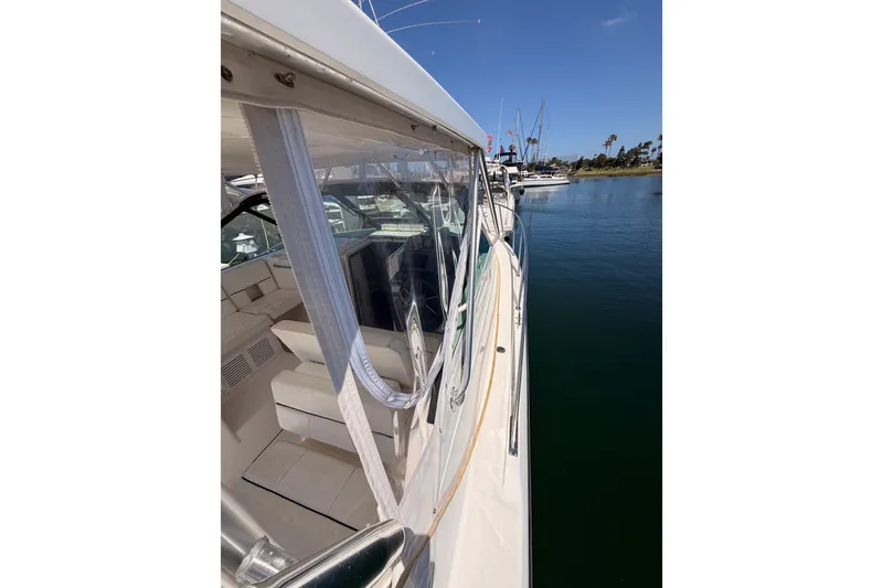 Slide: The Image of 2005 Tiara Yachts 2900 Open Classic docked, showcasing sleek design and spacious interior. - 19