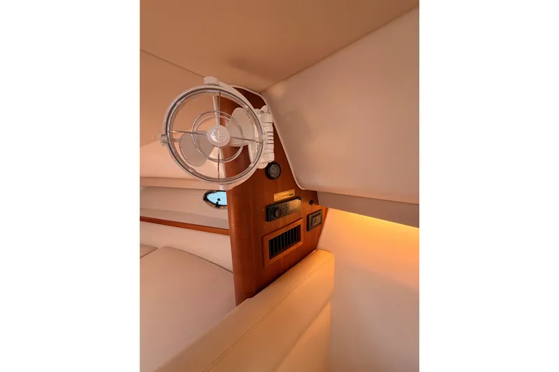 Slide: The Image of 2005 Tiara Yachts 2900 Open Classic cabin interior with fan and control panel. - 61