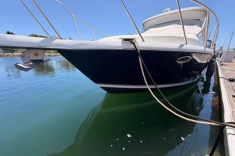 Slide: The Image of 2005 Tiara Yachts 2900 Open Classic docked in calm waters. - 77
