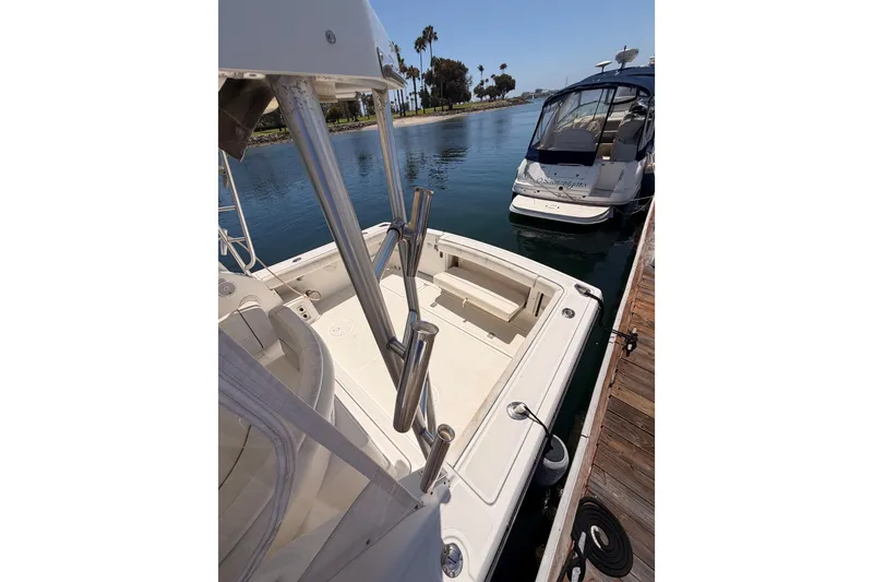 Slide: The Image of 2005 Tiara Yachts 2900 Open Classic docked, featuring spacious deck and sleek design. - 25