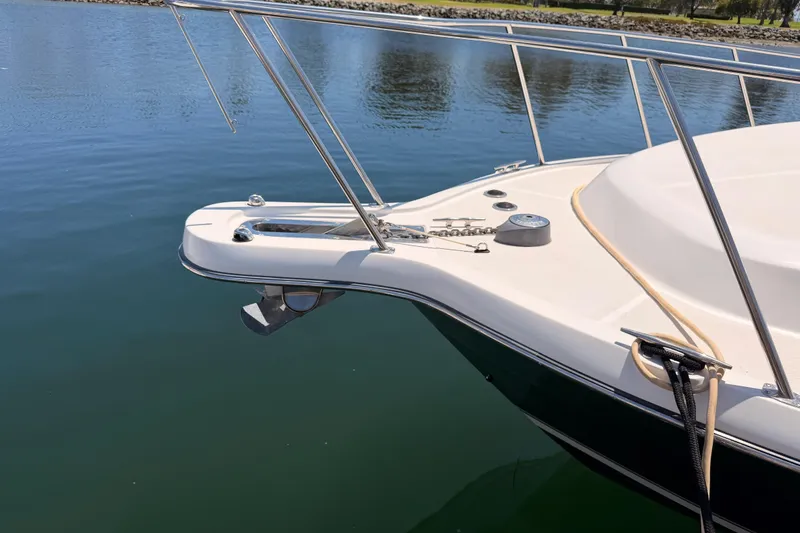 Slide: The Image of 2005 Tiara Yachts 2900 Open Classic bow with anchor and railing on calm water. - 3