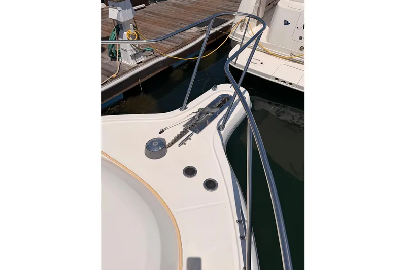 Slide: The Image of 2005 Tiara Yachts 2900 Open Classic bow with anchor chain at dock. - 21