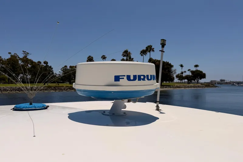 Slide: The Image of Radar equipment on 2005 Tiara Yachts 2900 Open Classic, with scenic waterfront view. - 24