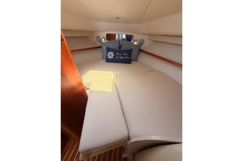 Slide: The Image of 2005 Tiara Yachts 2900 Open Classic cabin interior with cozy bedding and nautical decor. - 67