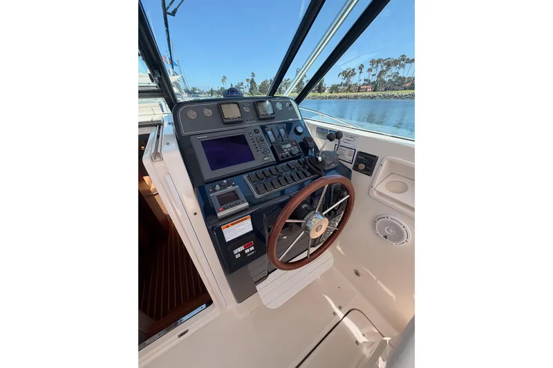 Slide: The Image of Helm of 2005 Tiara Yachts 2900 Open Classic, featuring navigation controls and steering wheel. - 31