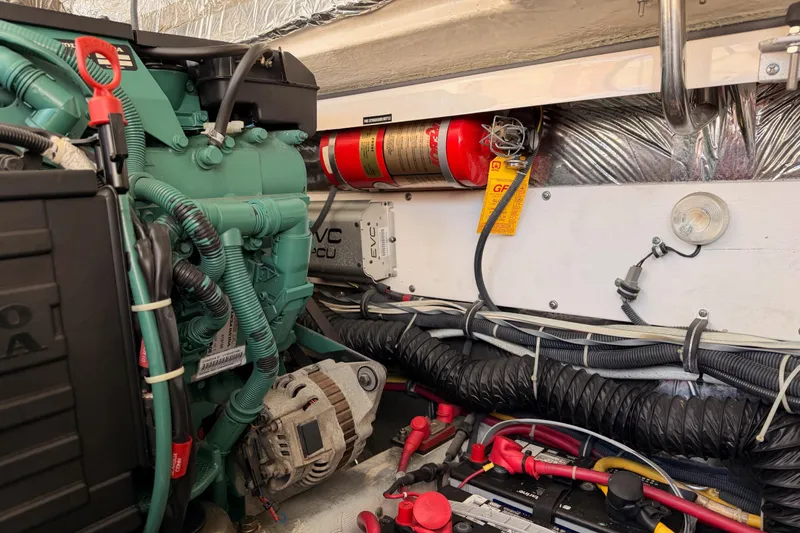 Slide: The Image of Engine compartment of a 2005 Tiara Yachts 2900 Open Classic, featuring a Volvo Penta engine. - 83