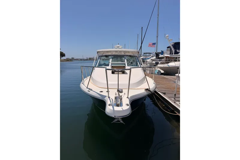 Slide: The Image of 2005 Tiara Yachts 2900 Open Classic docked in a marina, front view. - 2
