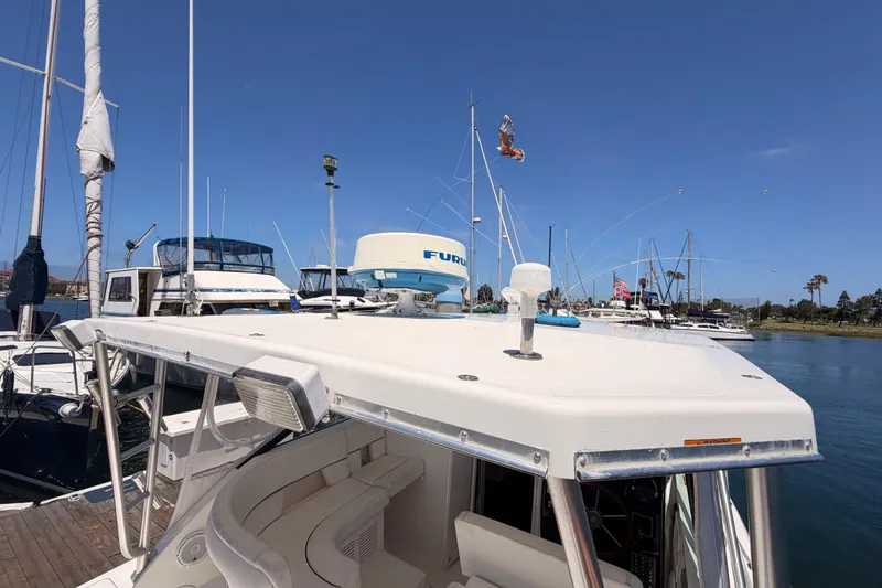 Slide: The Image of 2005 Tiara Yachts 2900 Open Classic docked in a marina under clear blue skies. - 18