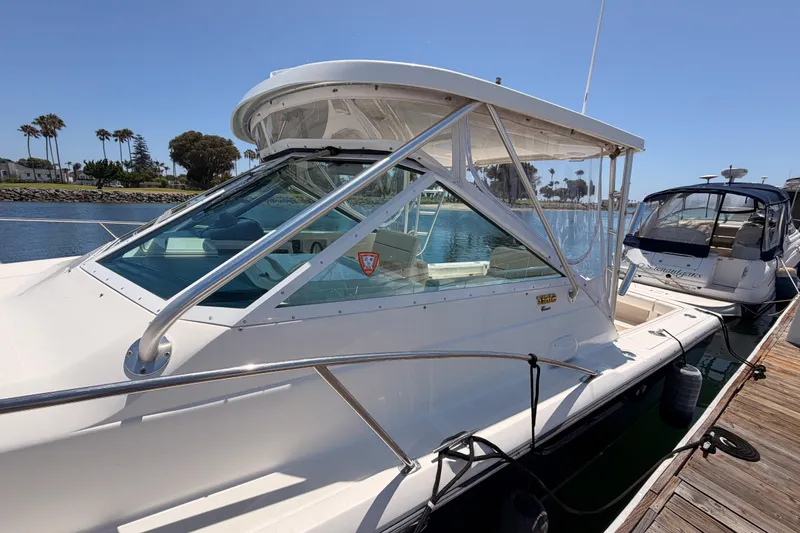 Slide: The Image of 2005 Tiara Yachts 2900 Open Classic docked, showcasing sleek design and spacious cockpit. - 5